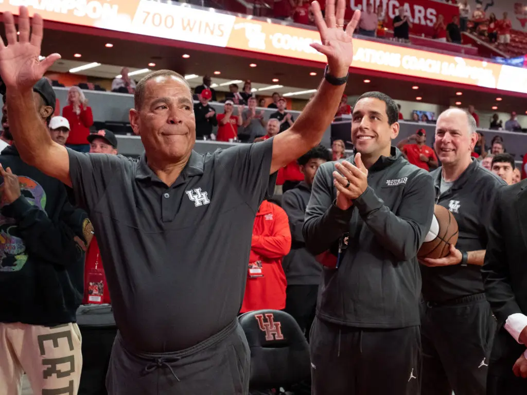 UH coach Kelvin Sampson celebrated 700 wins with his son and lead assistant Kellen Sampson at his side as usual. (Photo by F. Carter Smith)