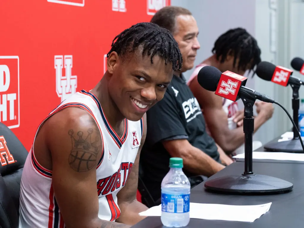 Marcus Sasser sometimes needs to look away and smile when UH coach Kelvin Sampson breaks down a game in the postgame press conference. (Photo by F. Carter Smith)