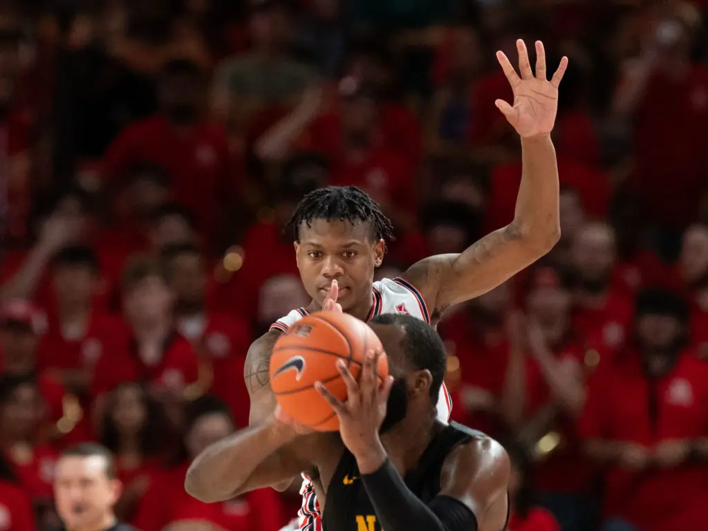 Sometimes it seems like UH and Marcus Sasser loom over opponents. (Photo by F. Carter Smith)