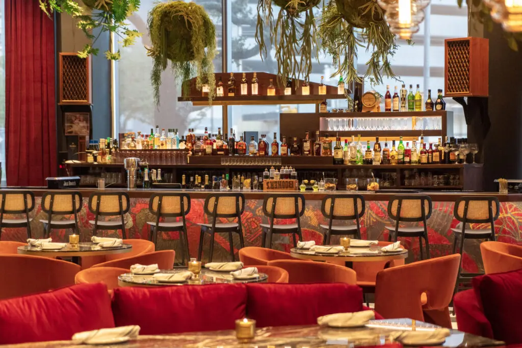 A glowing library of fine whiskeys and other spirits crowns the bar at the new restaurant, The Lymbar, located at The Ion. (Photo by Dylan McEwan)