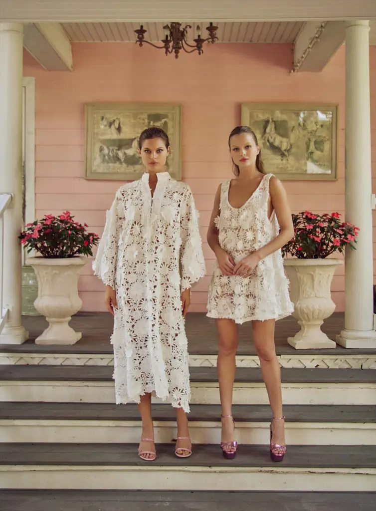 White 3D Lace Maxi Caftan ($850) and Mini Swing Dress ($650). (Photo by Élio Nogueira)