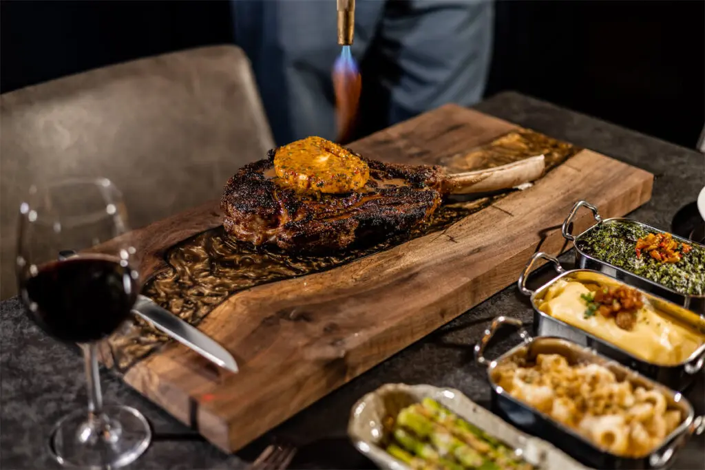 The Texas Wagyu Tomahawk Chop (Wagyu-X) with Calabrian chili compound butter is a highlight on The Saint's menu. (Photo by Kayla Enright)