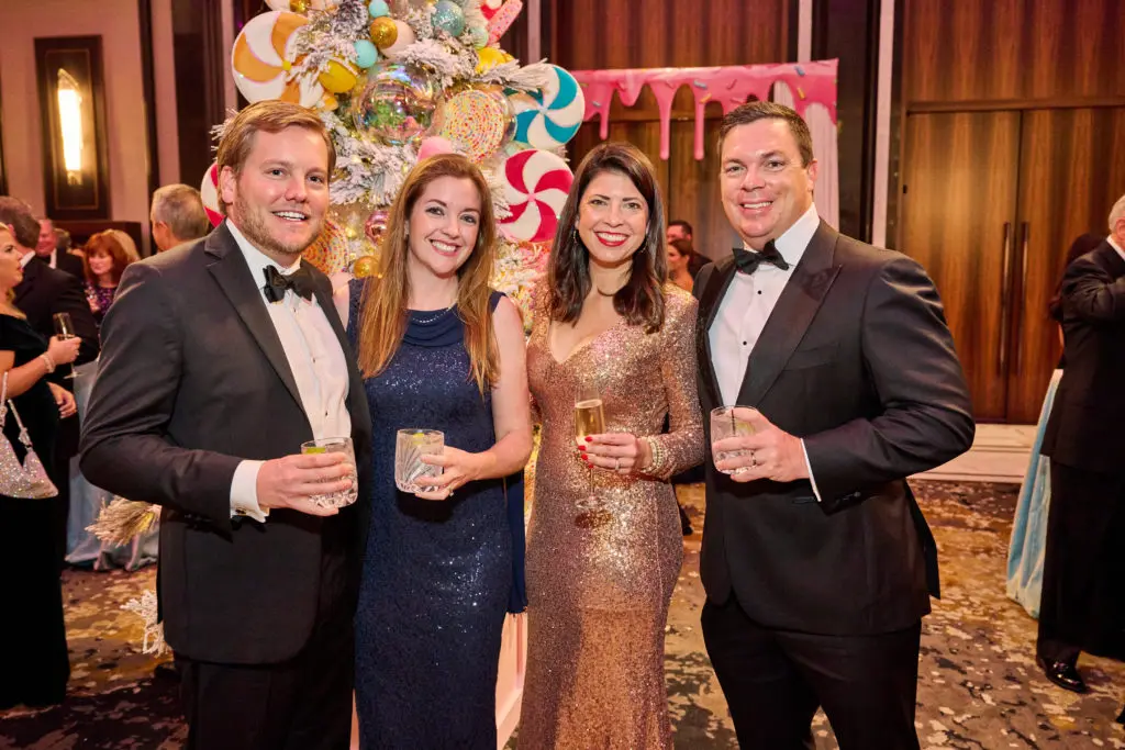 Amanda & John Taylor, Lindsay & Jason Weddle at the Spindletop Holiday Ball. (Photo by Fulton Davenport/PWL Studio)