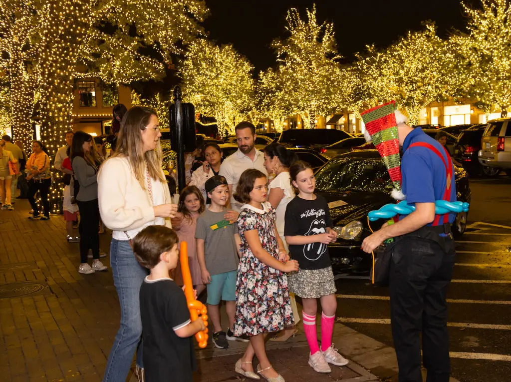 Balloon Twisting was among the kid-friendly attractions at the shopping stroll.  (Photo by George Fiala)