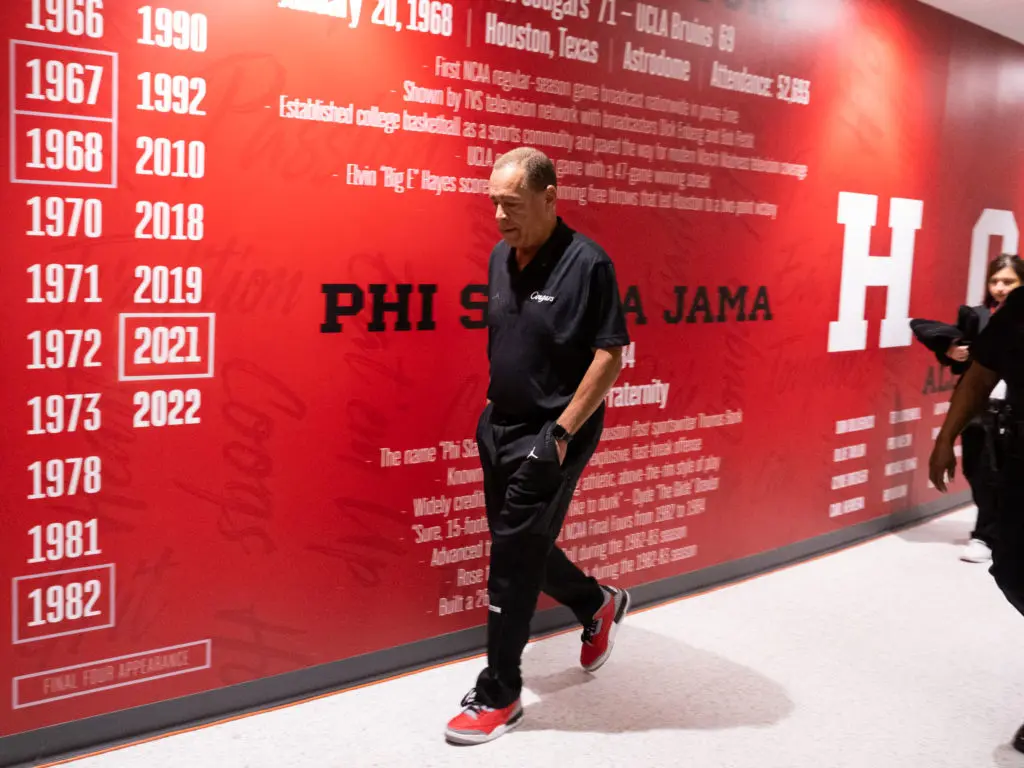 It's not always easy being the man in charge of the program. UH coach Kelvin Sampson still always seems to handle it. (Photo by F. Carter Smith)