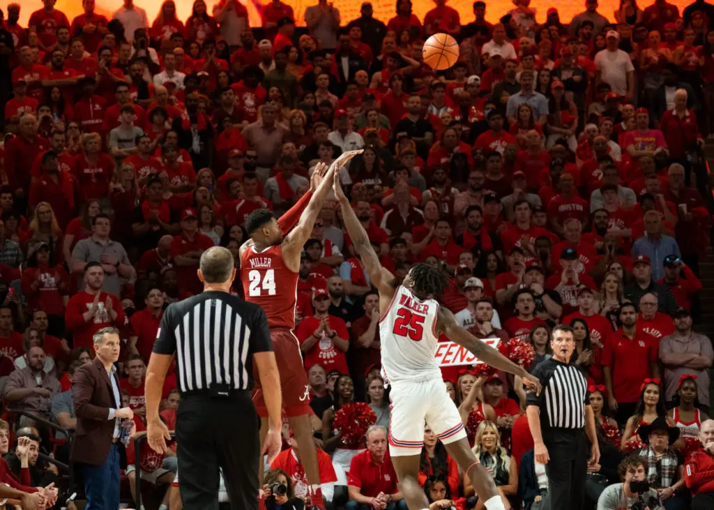 Jarace Walker fouling Alabama freshman Brandon Miller on a 3-point shot is not what UH coach Kelvin Sampson wants to see. (Photo by F. Carter Smith)