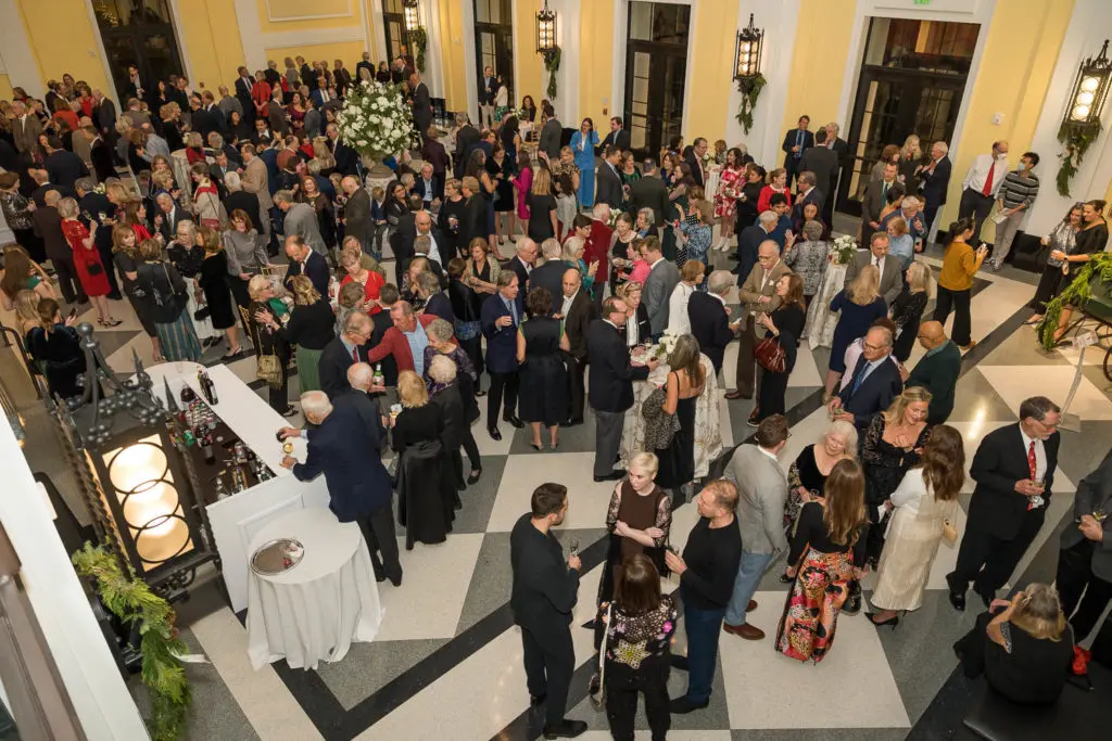 Guests gather in the Grand Foyer of Rice University's Brockman Hall for Opera for the Shepherd School of Music 'Spirit of the Season' event. (Photo by Trish Badger)