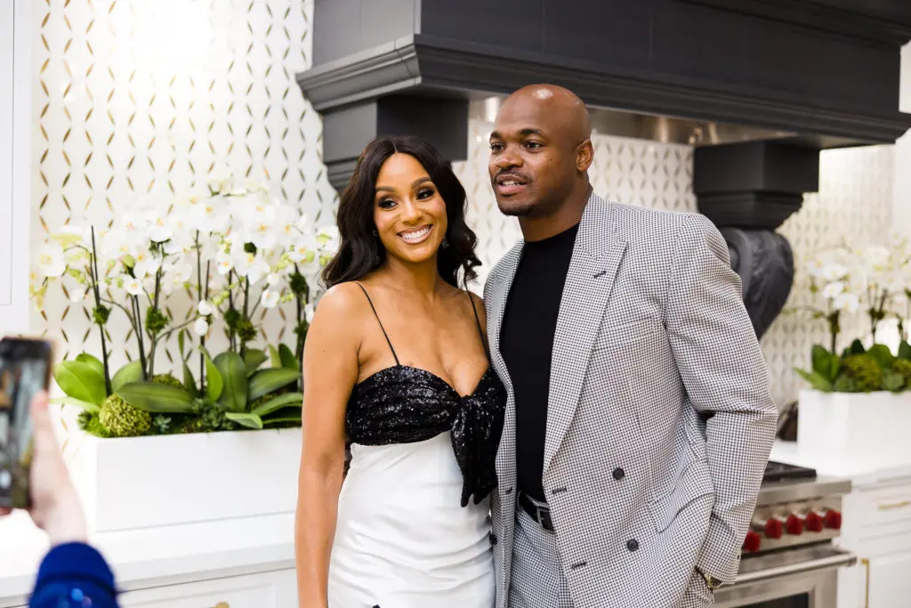 Ashley & Adrian Peterson at the Woodlands Fashion extravagaza (Photo by Hung Truong Photography)