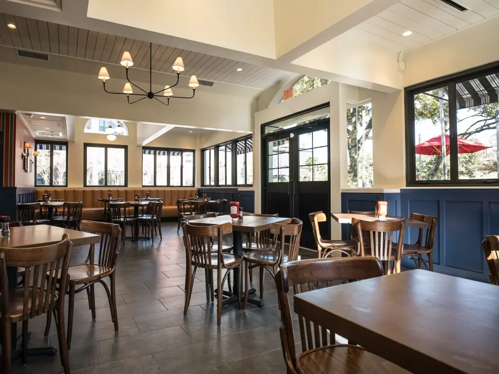 Interior details of the completed Becks Prime restaurant renovation include red and blue striped wallpaper hung with memorabilia from first days Beck's was established. (Photo by Daniel Ortiz Photography)