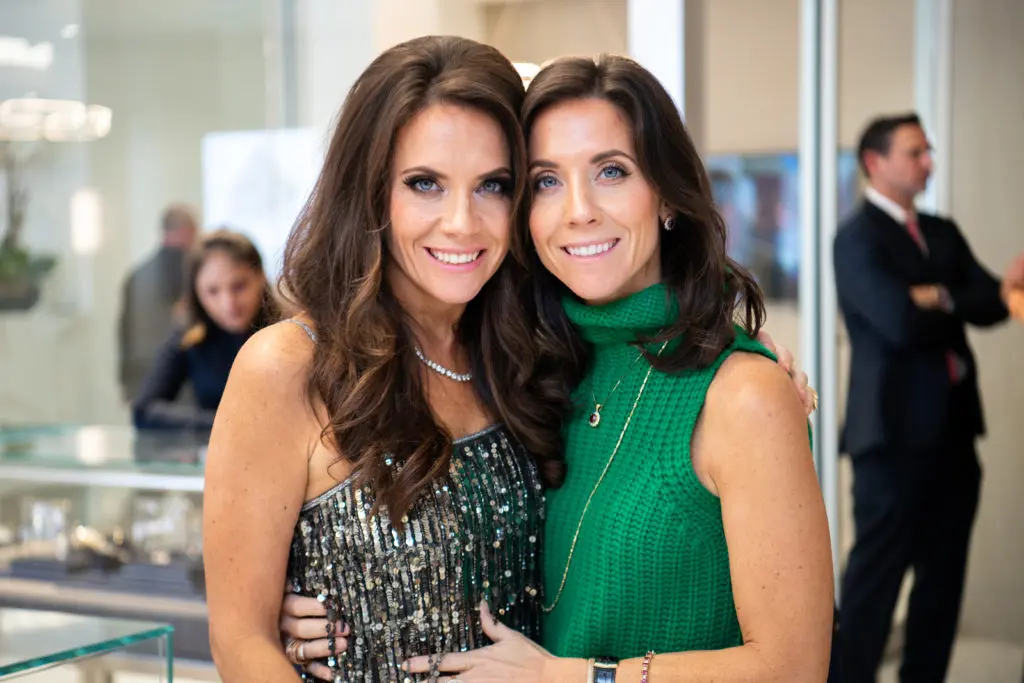 Identical twins Joanna Marks and Hannah McNair at the IW Marks Jewelers grand re-opening party.