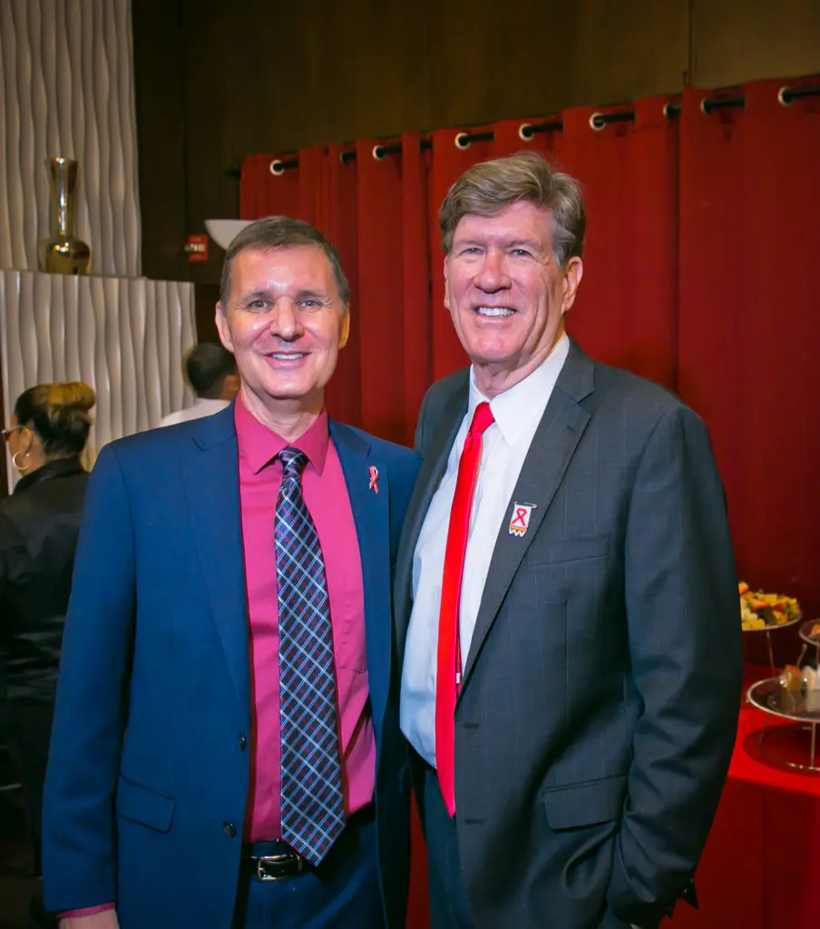 John Huckaby, and award recipient Michael B. Mizwa at the AIDS Foundation Houston World AIDS Day luncheon. (Photo by Morris Malakoff)