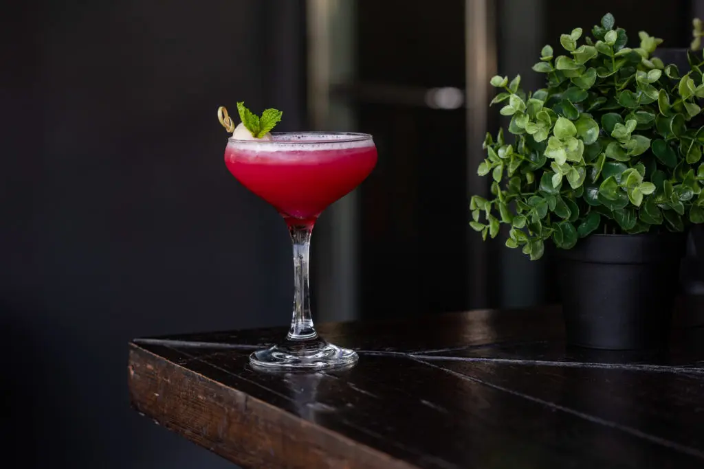 The rosy-hued cocktail Lychee Rose at the new restaurant, Ten Sushi + Cocktail Bar. Photo by Kirsten Gilliam.