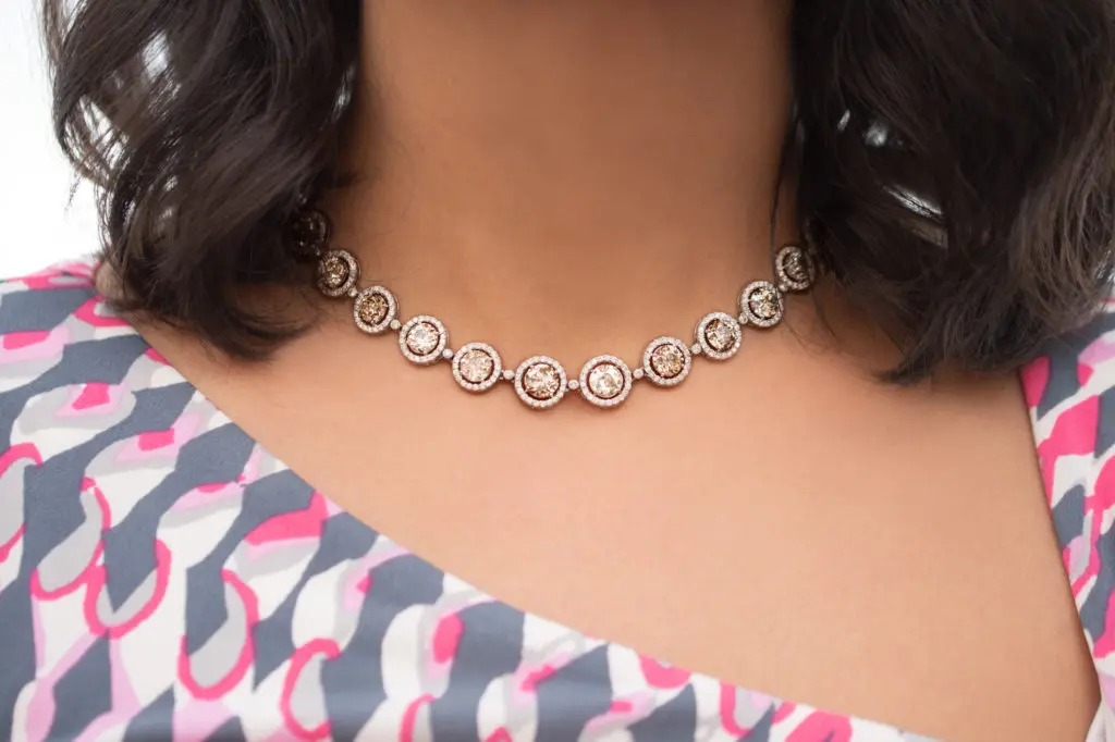 Important estate old European-cut fancy brown diamond necklace with round brilliant-cut white diamond frames