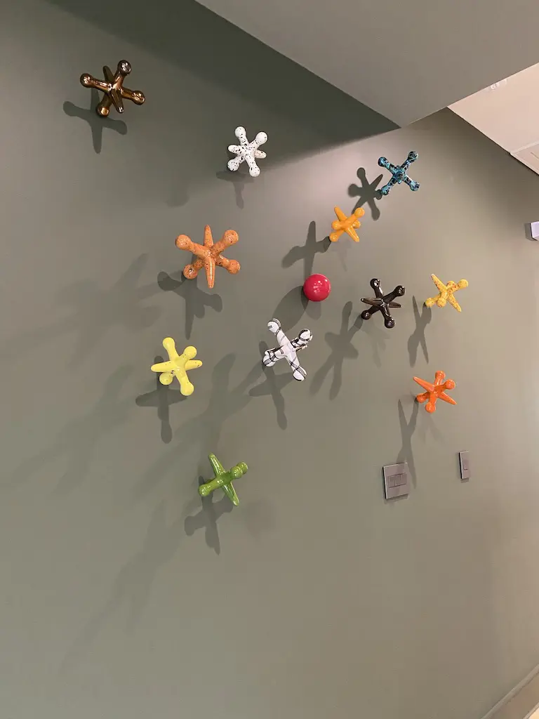 Over-sized jacks on the wall of the second floor family room in the ASID Show House.