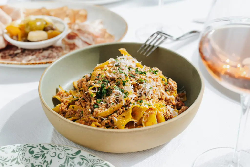 Tagliatelle Bolognese brings braised brisket, veal and pork based sugo with aged parmesan at 61 Osteria. (Photo by Kathy Tran)