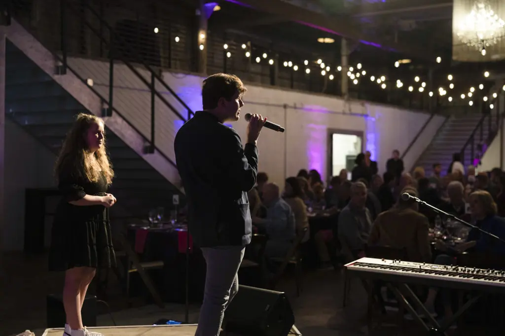 Spotlight Cast & Crew Co-Founder Joe Westermann explains the organization's mission at the Sneaker Soiree Cabaret in Fort Worth, Texas on January 12, 2023. (Photo by Ellman Photography)