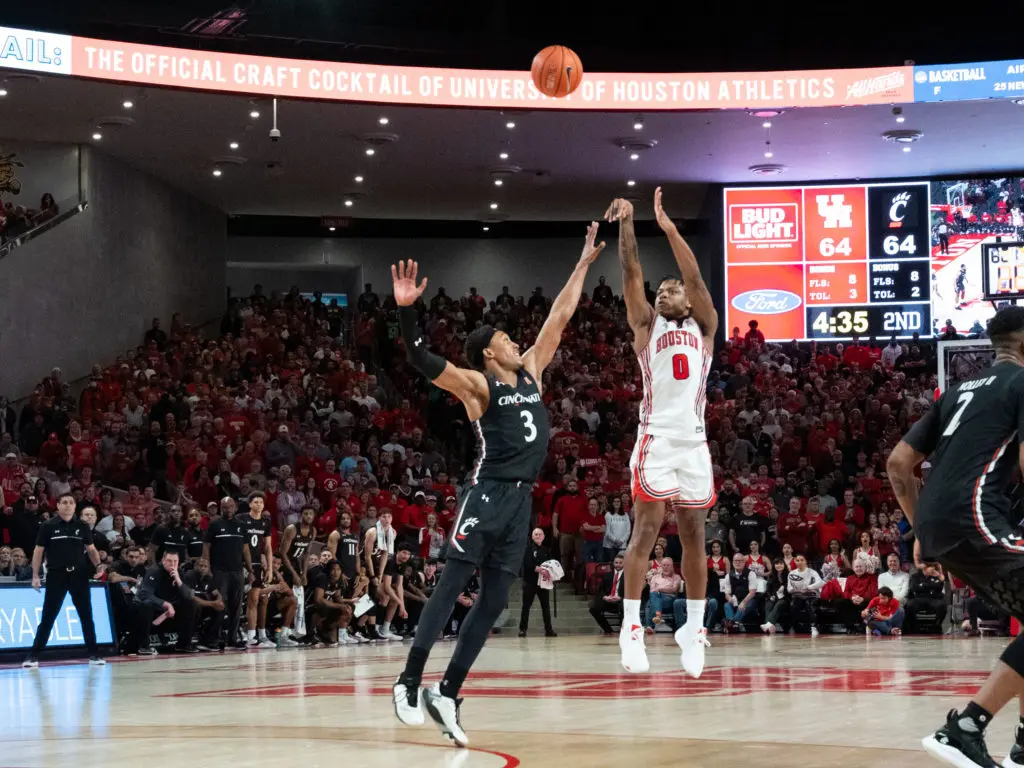 University of Houston guard Marcus Sasser can get his shot off with only a sliver of room. (Photo by F. Carter Smith)