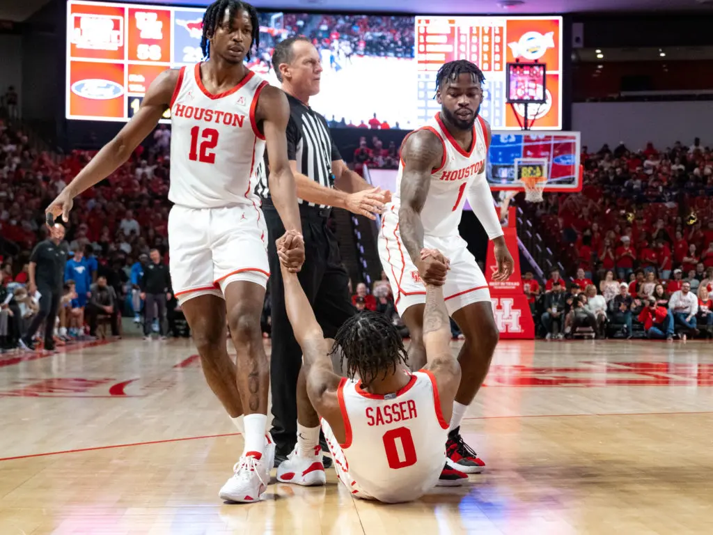 When any of their teammates fall down, UH's players will lift them back up. (Photo by F. Carter Smith)