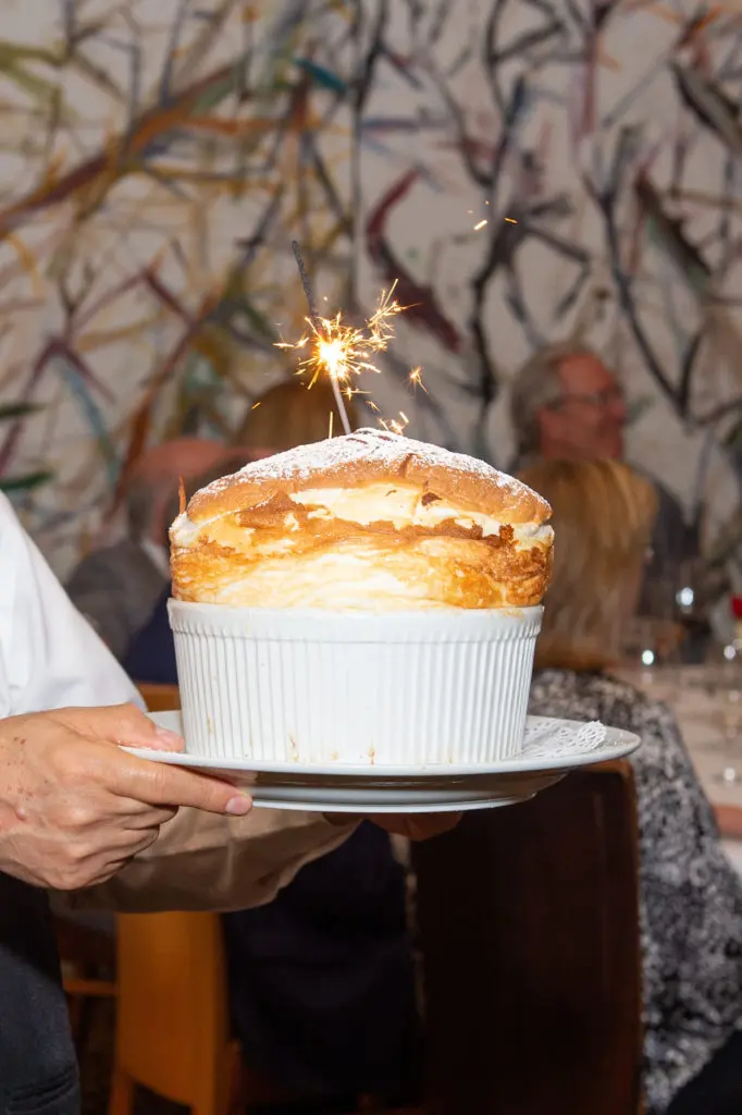 Tony's famed Grand Marnier soufflé making the rounds at the CanCare wine dinner. (Photo by Jacob Power)