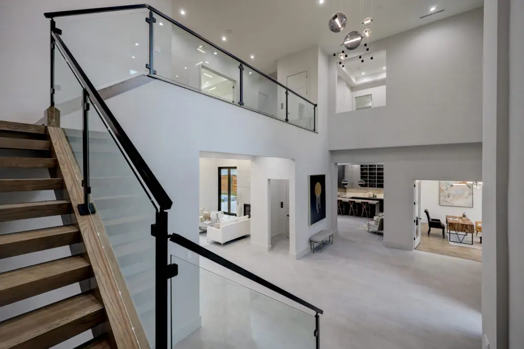 The two-story foyer in Levant Luxury Homes' latest project at 275 Pine Hollow Lane, represented by DeeDee Guggenheim Howes of Compass. (Photo by TK Images)