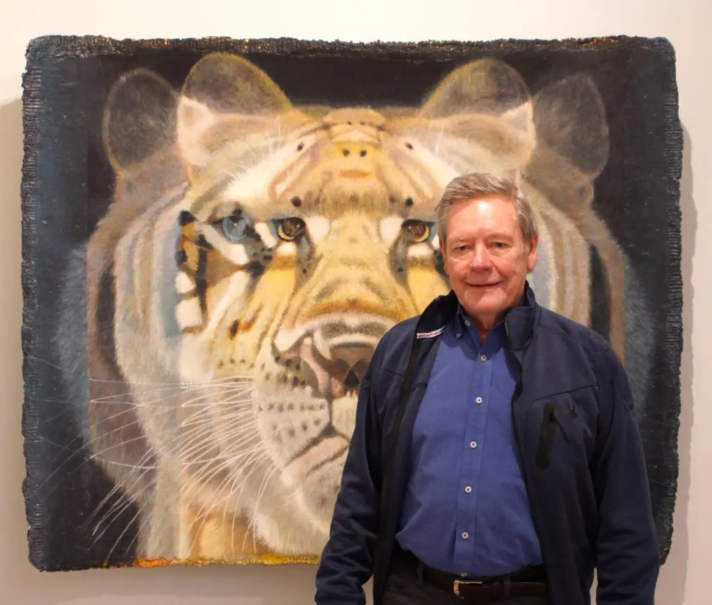 Gremillion & Co. Fine Art owner Ron Gremillion with Eric Peters' "Q-bistic Tiger No. 3." (Courtesy Gremillion & Co. Fine Art and Horizon on Sunset) 