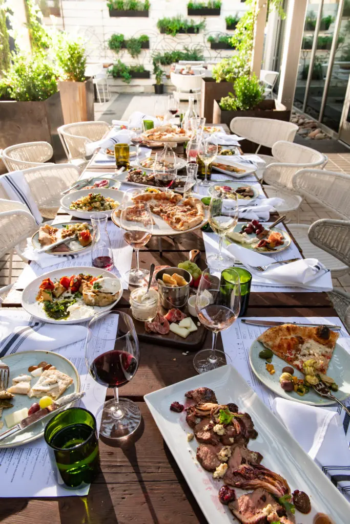You can dine with friends and share wine and food at The Woodland's new Sixty Vines restaurant.