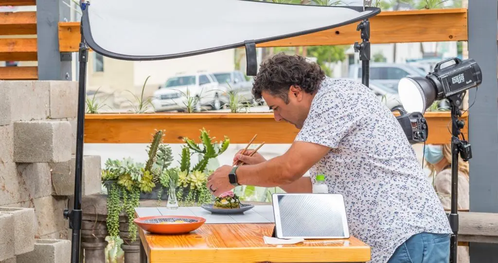 Chef Lanny Lancarte makes sure his Righteous Foods is photo ready. Righteous Food is one of Fort Worth's Best Vegan Restaurants.