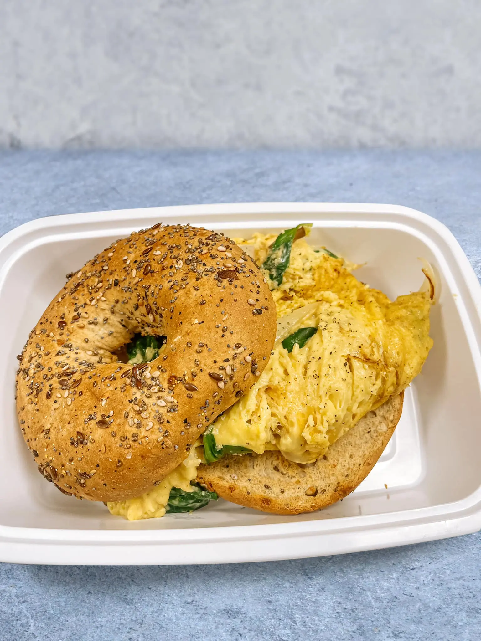Vegan – Just Eggs scramble on fresh bagel at Von’s Coffee Shop.