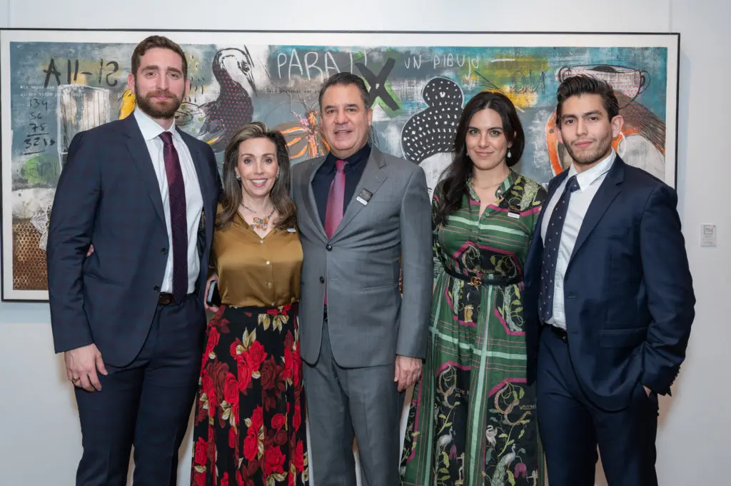 Art of the World Gallery staff toast to Amador Montes at his solo debut exhibition, "Under The Skin"; Mauricio Sampogna, Liliana Molina, Mauricio Vallejo, Pamela Encinas and Jaime Obeso. (Left to Right); Photo Credit: Paul R. Davis 