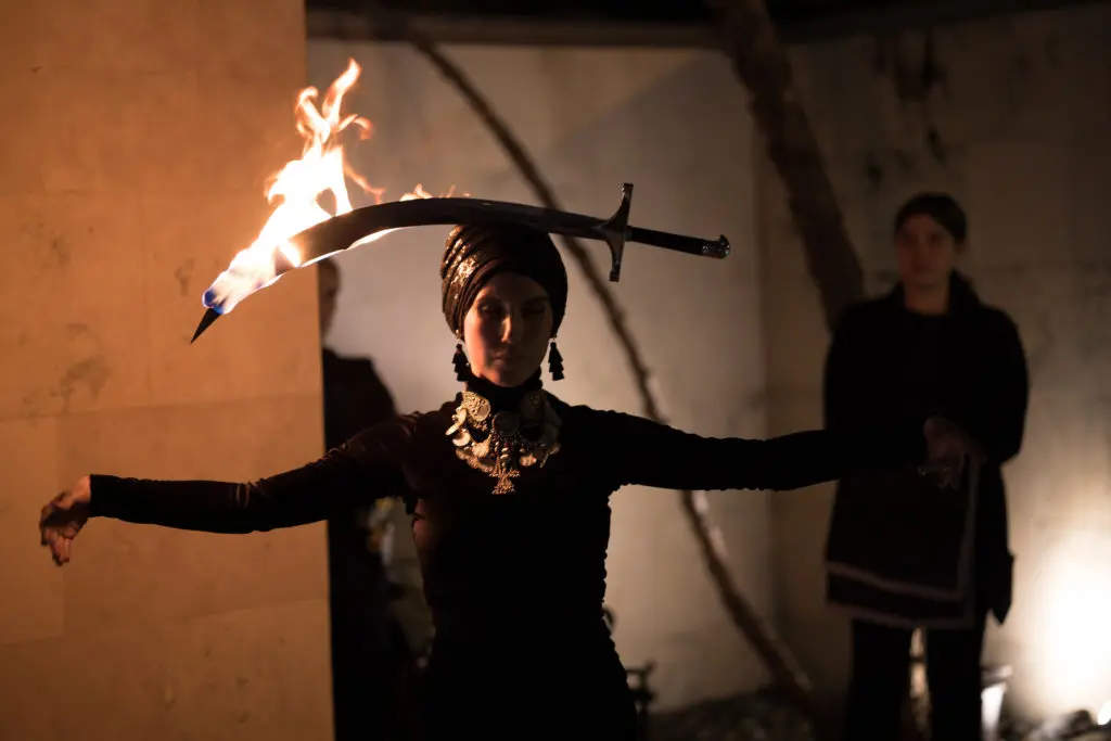 An exotic fire dancer performs at Darryl Sharpton's birthday bash in his River Oaks home. (Photo by Emile C Brown)