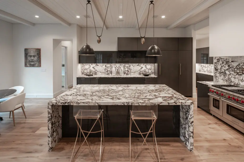 Sold by Moni Bohnisch in 2021, this Tanglewood residence by Sims Luxury Builders features bold use of marble in a spectacular kitchen design. (Photo Steven Chen)