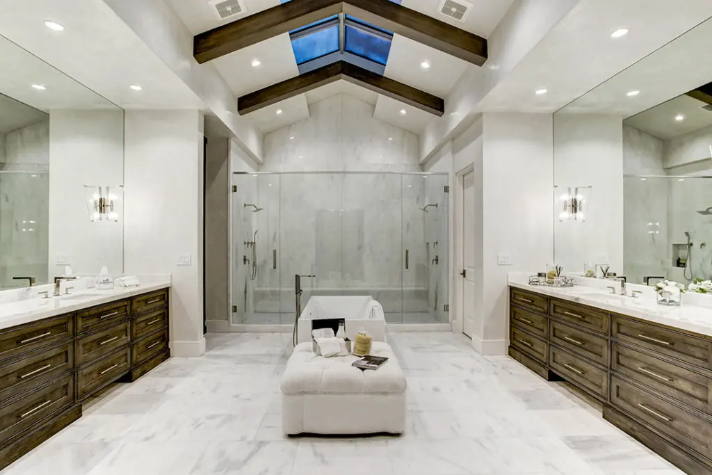 The primary suite at 5554 Longmont Drive by Sims Luxury Builders features a stunning spa-like bathroom with skylight, sold by Moni Bohnisch in 2021. (Photo TK Images)
