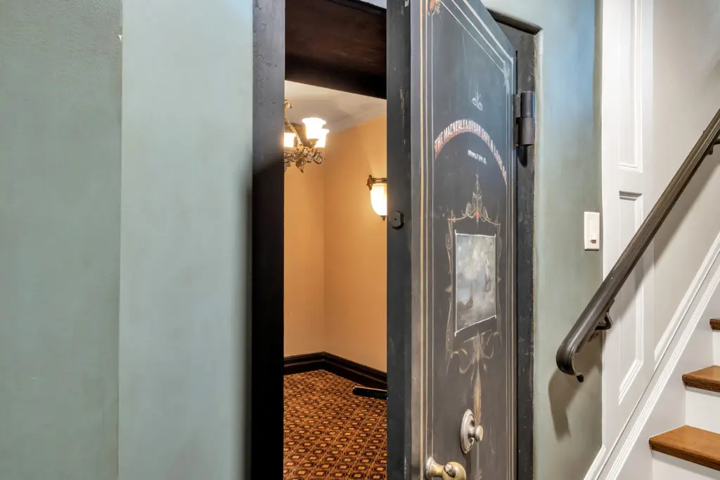 The original bank vault remains installed inside this historic register home.