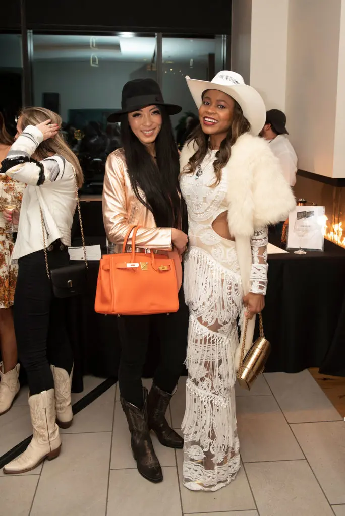 Cattle Baron's Ball Reveal Party guests in "western chic" attire. (Photo by Tamytha Cameron)