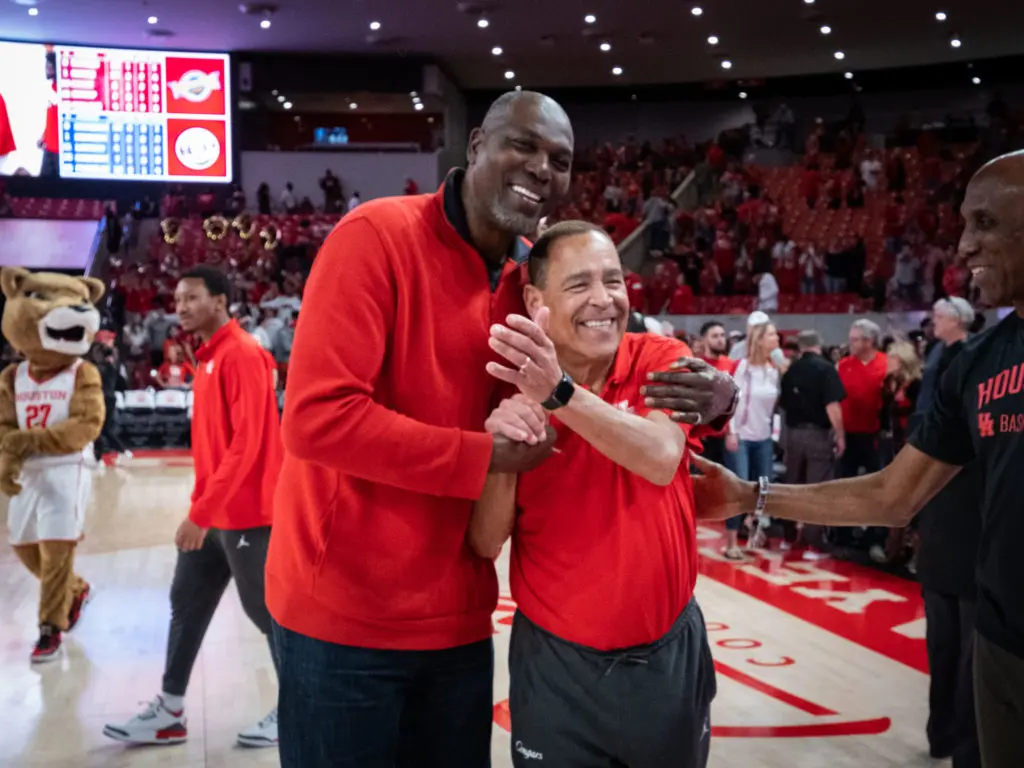 Basketball Hall of Famer Hakeem Olajuwon and University of Houston coach Kelvin Sampson make each other smile. (Photo by F. Carter Smith)