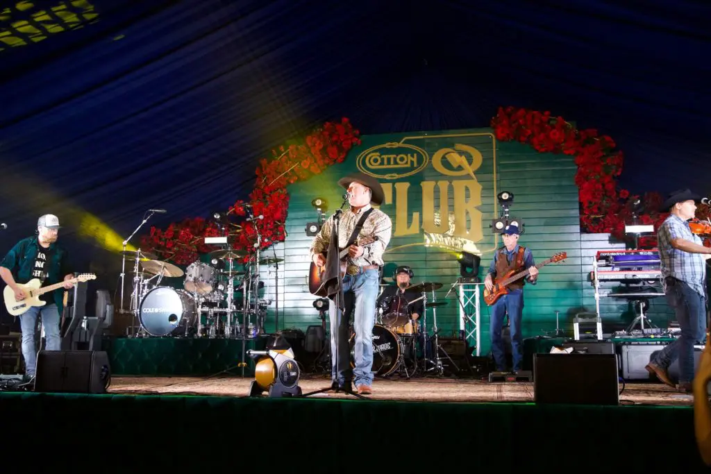 Cooper Wade performs at Cotton Holding's Cotton Q Club at the Houston Livestock Show & Rodeo barbecue cook-off. (Photo by Ashley Patranella, Painted Peacock Photography)