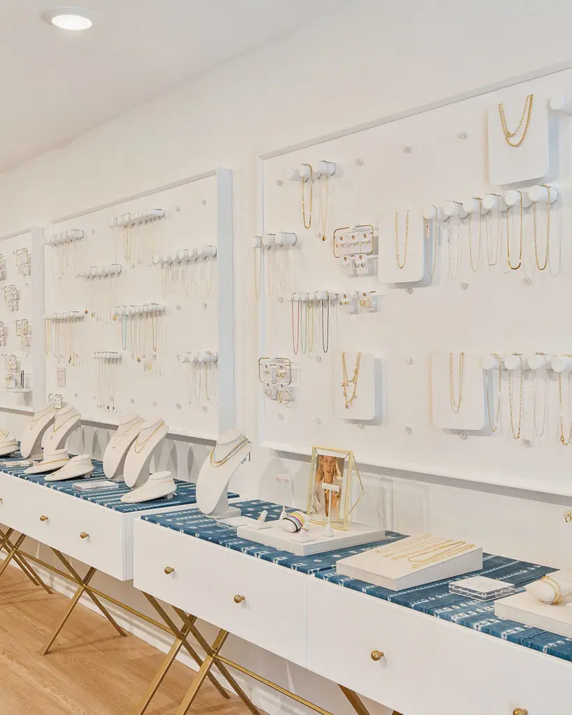 The walls are lined with products to explore inside a Gorjana jewelry boutique.