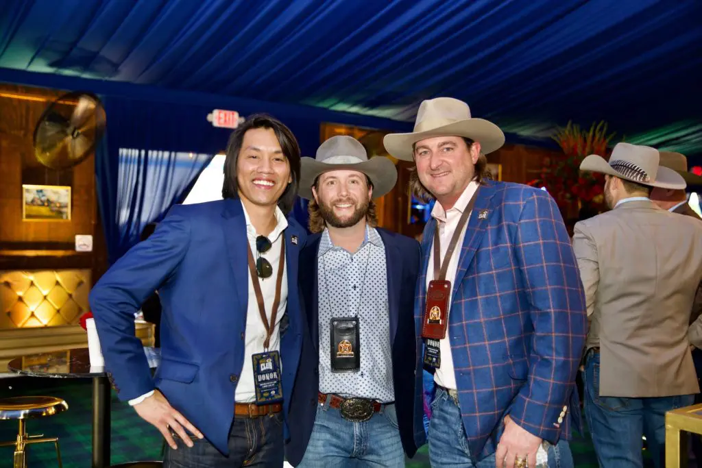 Norbert Tran, Travis Bice, Russell White at Cotton Holdings' Cotton Q Club at the Rodeo Houston barbecue cook-off. (Photo by Ashley Patranella, Painted Peacock Photography)