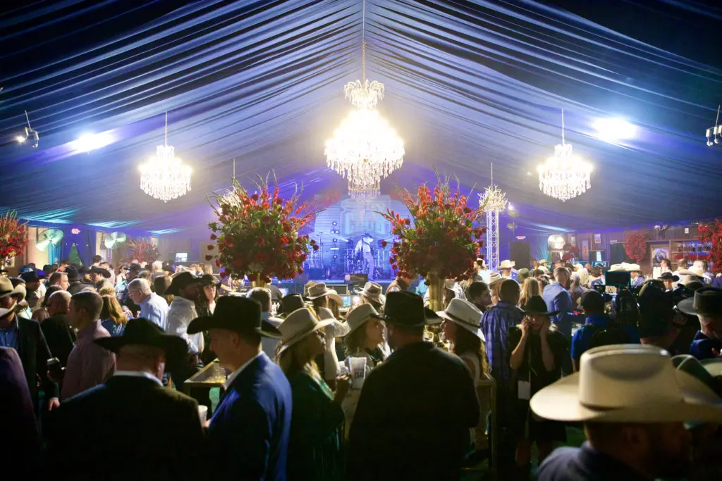 More than 650 party goers joined the Cotton Holdings Cotton Q Club at the Rodeo Houston barbecue cook-off. (Photo by Ashley Patranella, Painted Peacock Photography)