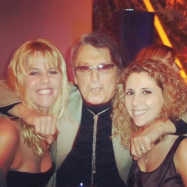 Authors Michele Alexander and Jeannie Long at premiere with Robert Evans in 2003 (Images provided by Michelle Alexander and Jeannie Long)