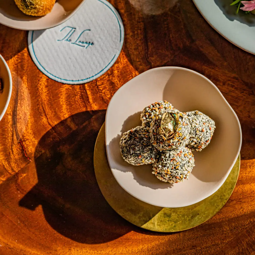 Foie Gras Loukoumades at the new lounge at March, which now serves mezze, cocktails, and wine on their Greek-inspired menu this season. (Photo by Zach Horst)