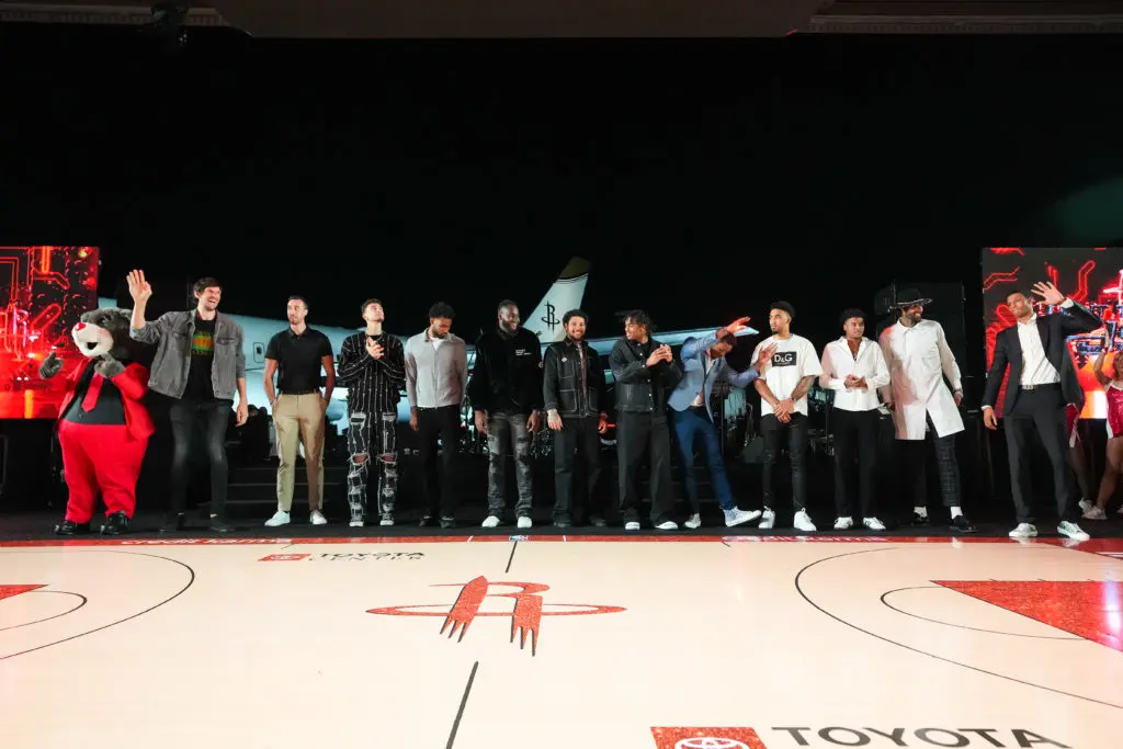 The Houston Rockets in the spotlight at the teams' Clutch City Foundation gala at the Landry's hangar at Hobby Airport.