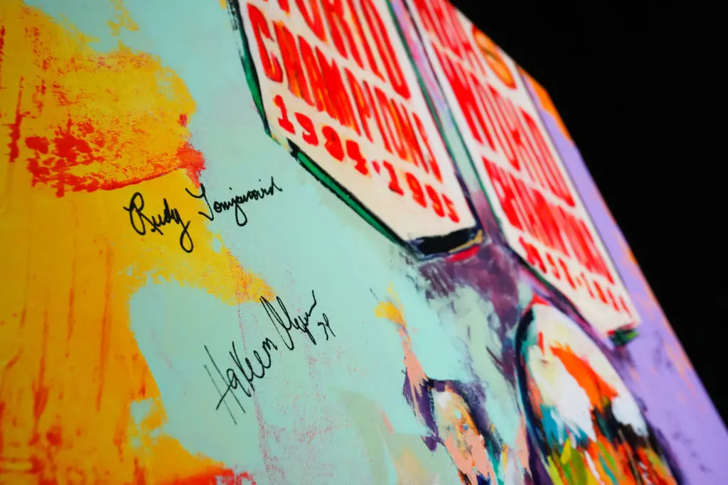 The big guys autograph Franky Cordona's painting auctioned off  at the Houston Rockets Clutch City Foundation gala at the Landry's hangar at Hobby Airport.