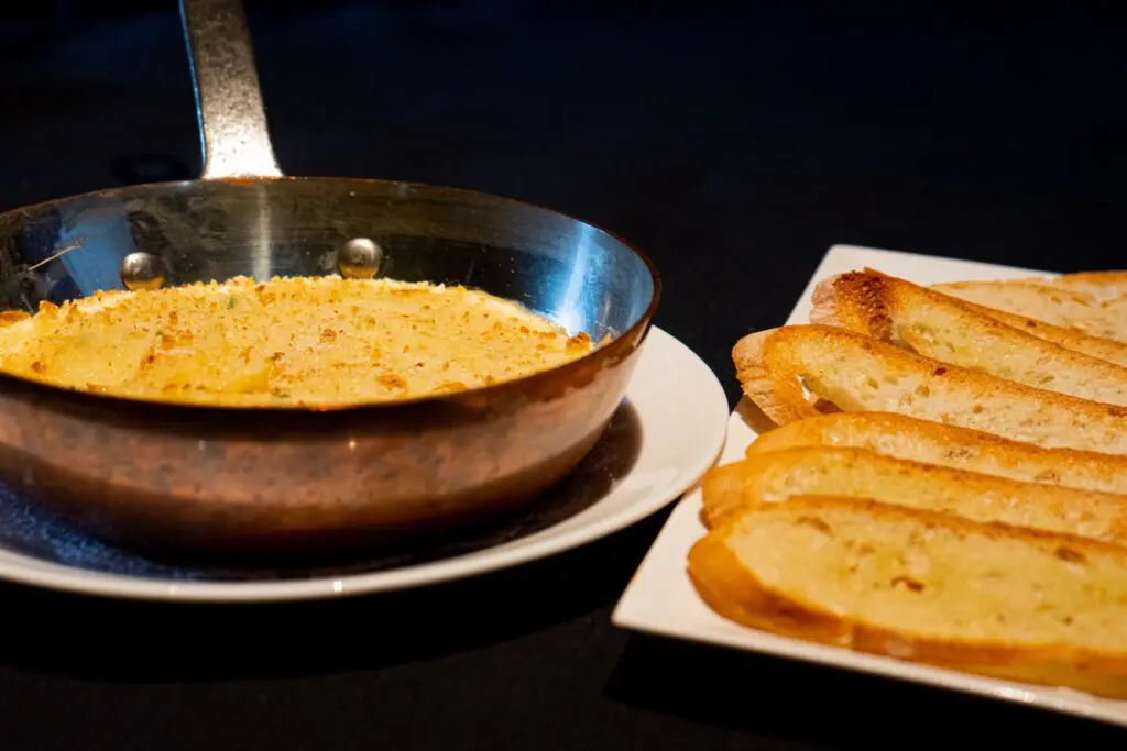 Made as it traditionally is in the Languedoc-Roussillon region of France with salted codfish pureed with potatoes and olive oil, the brandade is topped with panko bread crumbs, gratinéed and served alongside spears of toasted focaccia. 
 (Photo by Interiors: Raydon Creative, Food and Drink: Harold Cua)