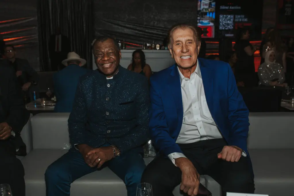 Calvin Murphy, Rudy Tomjanovich aboard the team jetliner at the Houston Rockets Clutch City Foundation gala at the Landry's hangar at Hobby Airport.