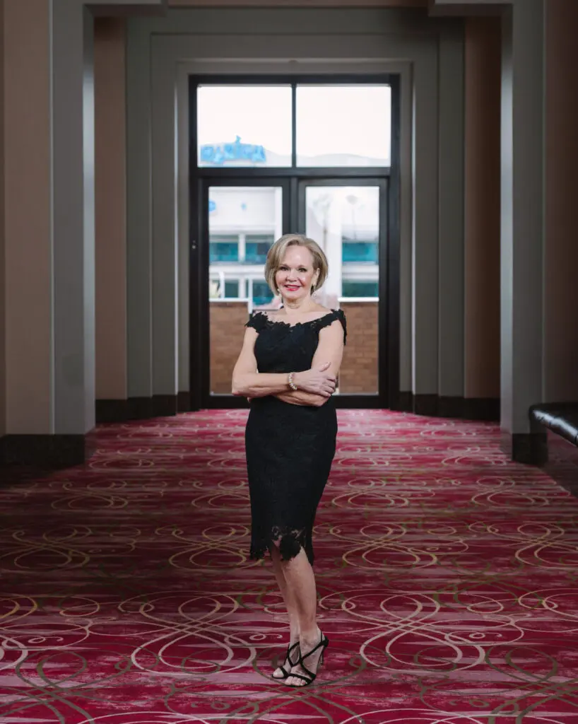 Janet Carrig is wearing a Romona Keveza dress from Tootsies. (Photo by Johnny Than)