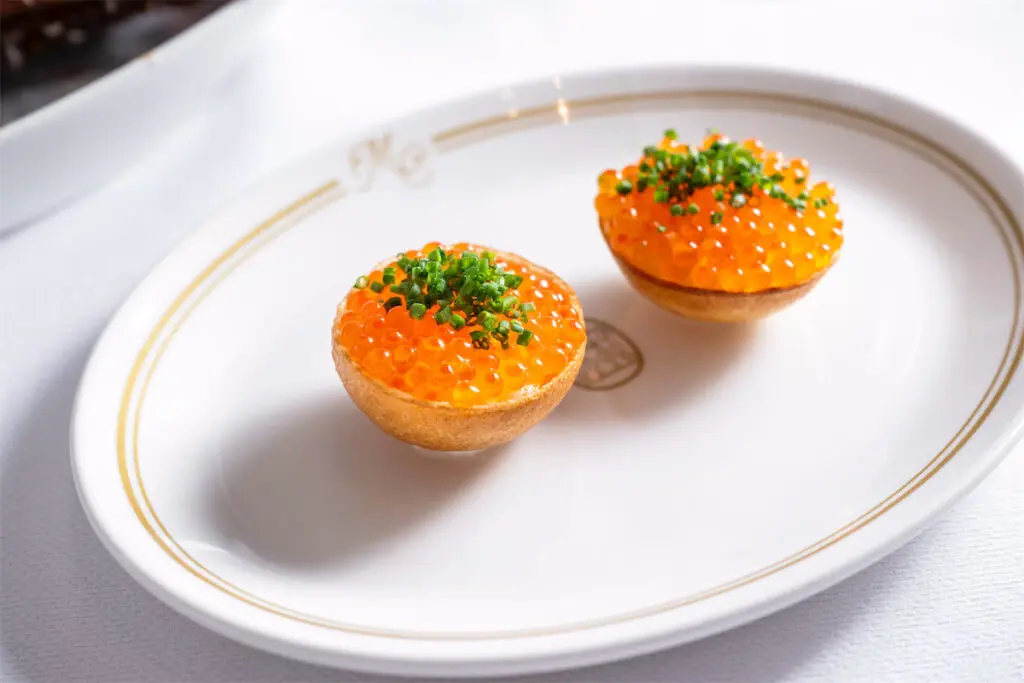 Mister Charles' menu includes canapés, pasta, appetizers like bluefin crudo, fish, steak, and dessert. (Photo by Evan Sung)