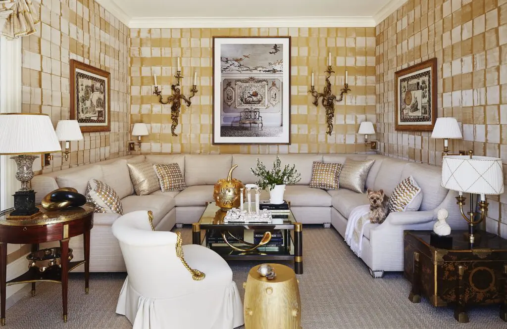 In a Bridgehampton beachside home, 
Anya Larkin hammered silk sheathes the sitting room, with photograph by Jean François Jaussaud. The Beauvais carpet is made of woven metallic leather. (Photo by William Abramowicz)