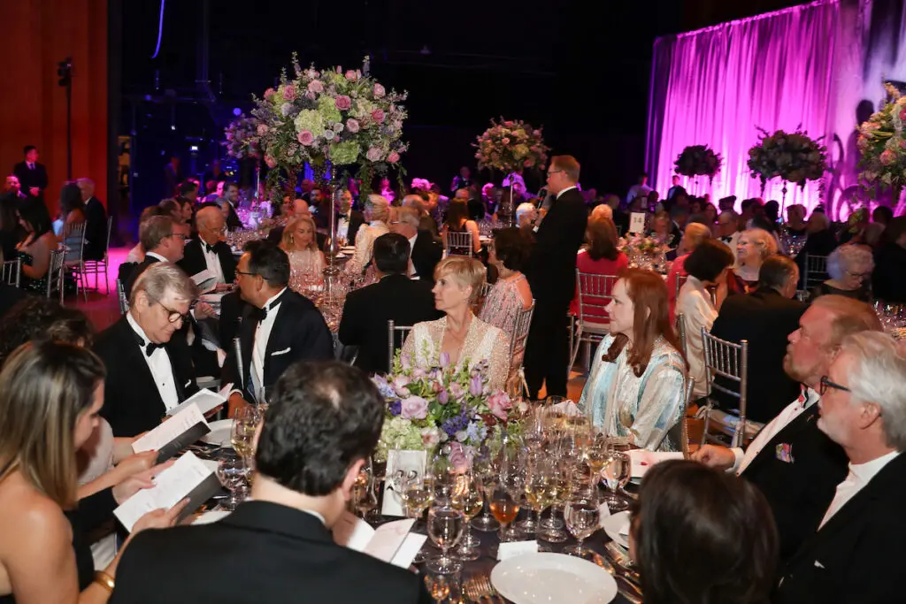 Guests dining on stage at Jones Hall for the Houston Symphony Wine Dinner & Collector's Auction (Photo by Priscilla Dickson)