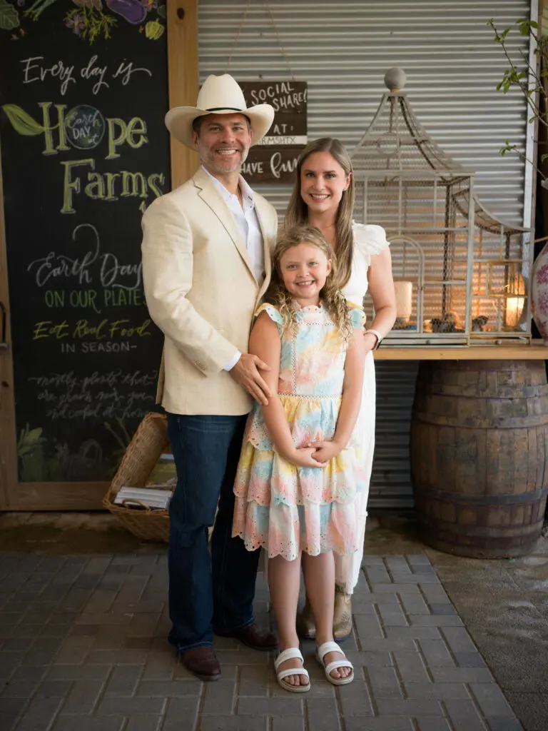 Aaron & Kristin Blomquist with daughter Isabelle at the Recipe for Success Fashion in the Fields fundraiser. (Photo by Daniel Ortiz)